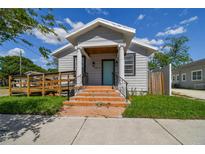 Charming house with a teal front door and welcoming porch at 2515 N Howard Ave, Tampa, FL 33607