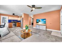 Open-concept living room with tile flooring connecting kitchen and living area at 2619 Miriam S St, Gulfport, FL 33711