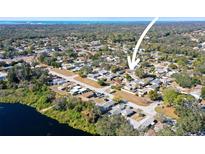 Aerial view showcasing the home's waterfront proximity and neighborhood setting at 3108 Ash Ct, Dunedin, FL 34698