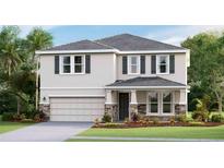 Two-story house with gray shutters, stone accents, and a two-car garage at 17916 Tavernside Trl, Lakewood Ranch, FL 34211