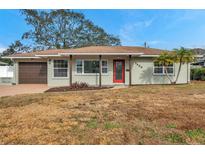 Updated craftsman style home with a red door and attached garage at 5425 36Th N Ave, St Petersburg, FL 33710