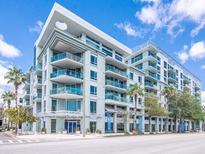 Modern condo building with balconies and palm trees at 111 N 12Th St # 1615, Tampa, FL 33602