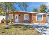 Cute ranch home with a landscaped yard and driveway at 8510 River Oaks Dr, Tampa, FL 33615