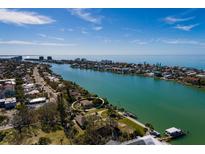 Aerial view of waterfront property with private dock at 9320 Gulf Blvd, St Pete Beach, FL 33706