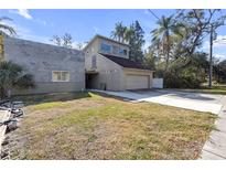 Contemporary two-story home with attached garage and expansive yard at 4408 W Leona St, Tampa, FL 33629