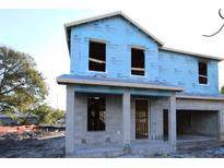 New construction home with gray siding and a white garage door at 507 N Bradford Ave, Tampa, FL 33609