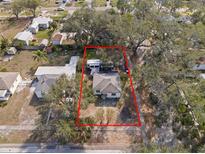 Charming single-story home on a verdant lot, as seen from an aerial perspective at 738 59Th Ne Ave, St Petersburg, FL 33703
