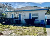 Cute bungalow style home with blue accents and a small front yard at 119 11Th Ave, Indian Rocks Beach, FL 33785