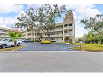 Condo building with ample parking and landscaping at 2351 Irish Ln # 21, Clearwater, FL 33763