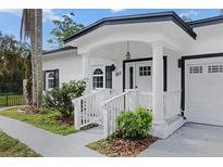 Updated home exterior boasts a modern design, and a two-car garage at 3811 River Grove Ct, Tampa, FL 33610