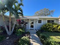 Inviting home exterior featuring landscaped front yard and walkway at 5730 16Th Ne Ln, St Petersburg, FL 33703