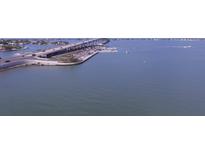 Aerial view of bridge, water, and roadway at 100 Bluff View Dr # 401A, Belleair Bluffs, FL 33770