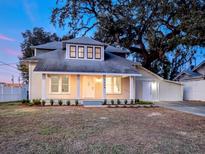 Charming remodeled craftsman home with a large front porch and landscaped yard at 1404 W Granfield Ave, Plant City, FL 33563