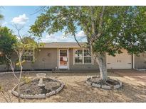 Cute ranch home with a large tree and nicely landscaped yard at 5157 School Rd, New Port Richey, FL 34653