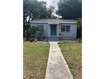 Charming bungalow with landscaped lawn and walkway at 2421 19Th S St, St Petersburg, FL 33712