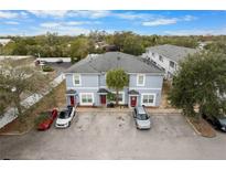 Aerial view of a triplex with parking and landscaping at 9206 Bella Terraza Way, Temple Terrace, FL 33617