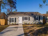 Charming single-story home with neutral paint, black shutters, and a well-manicured front yard at 4751 Fairfield S Ave, St Petersburg, FL 33711