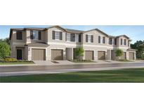 Modern townhome community with attached garages and well-manicured lawns at 5190 Meyer Bessie St, Zephyrhills, FL 33541