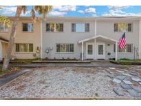 Inviting exterior of a two-story duplex with a landscaped front yard at 8324 Civic Rd, Tampa, FL 33615