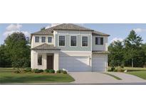 Two-story house with light blue and white siding, two-car garage, and landscaping at 18175 Serene Lake Loop, Lutz, FL 33548