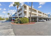 Condominium building with parking and landscaping at 215 Valencia Blvd # 106, Belleair Bluffs, FL 33770