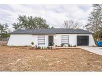 Newly renovated single-story home with a modern exterior at 6514 Mariner Blvd, Spring Hill, FL 34609