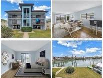 Updated condo building with light blue accents and waterfront views at 12080 Capri S Cir # 102, Treasure Island, FL 33706