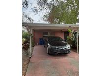 Covered carport with parking space for one car at 2408 Chilk Ave, Sarasota, FL 34234