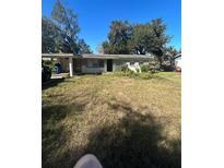 Ranch style home with mature trees and a large yard at 404 N Oakwood Ave, Brandon, FL 33510