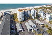 Aerial view of beachfront condo building with parking and ocean views at 17980 Gulf Blvd # 403, Redington Shores, FL 33708