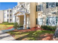 Exterior view of apartment building showcasing manicured landscaping and building facade at 18327 Bridle Club Dr # 18327, Tampa, FL 33647