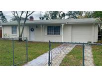 Charming ranch home with a well-maintained lawn and driveway at 4940 Rosedale Ln, Holiday, FL 34690