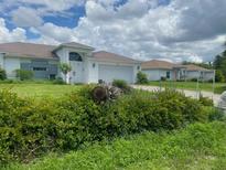 One-story home with a large yard and double garage at 8490 Leopold Ave, North Port, FL 34287