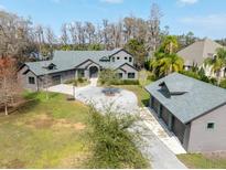 Luxury home with detached garage, large yard, and lakefront access at 16320 Rock Lake Dr, Odessa, FL 33556