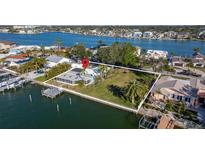 Waterfront home boasts a private dock and boat access, nestled in a serene coastal setting at 521 Harbor N Dr, Indian Rocks Beach, FL 33785