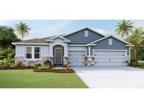 Two-story home with blue and gray siding, stone accents, and a three-car garage at 3426 Hazel Hollow Way, Plant City, FL 33565