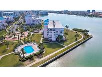 Stunning waterfront condo with a pool and lush landscaping overlooking the beautiful bay and waterfront views at 8040 Sailboat Key S Blvd # 304, St Pete Beach, FL 33707