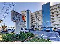 Sea Breeze condo with mature landscaping and signage; assigned parking for residents and guests at 13500 Gulf Blvd # 702, Madeira Beach, FL 33708