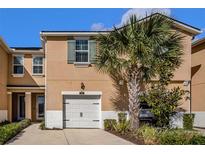 Charming two-story home with a one car garage and well-manicured landscaping, including a majestic palm tree at 5507 Cumberland Star Ct, Lutz, FL 33558