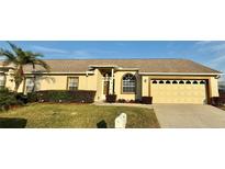 Charming single-story home featuring a well-manicured lawn, tasteful landscaping, and a two-car garage at 9337 Zamora Dr, New Port Richey, FL 34655