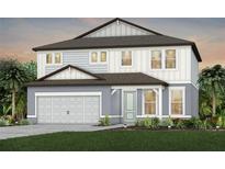 Two-story home featuring a neutral color palette, two car garage, and a well manicured lawn at 36424 Sespe Creek Ct, Zephyrhills, FL 33540