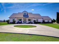 Single-story home with circular driveway and landscaping at 18531 Lithia Ranch Rd, Lithia, FL 33547