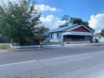 Charming single-story home with a front porch and mature trees at 3208 N 15Th St, Tampa, FL 33605