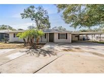 Charming single-story home with a well-manicured lawn and a covered carport at 5020 16Th N Ave, St Petersburg, FL 33710