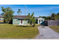 Charming single-story home features a well-maintained lawn and inviting curb appeal under a clear blue sky at 2749 16Th N Ave, St Petersburg, FL 33713