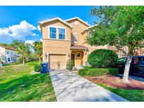 Charming two-story home featuring a well-maintained lawn, driveway, and an attached garage at 780 Spring Flowers Trl, Brandon, FL 33511