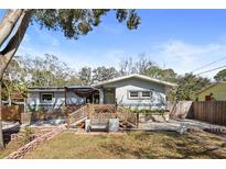 Charming one-story home with a front yard and decorative fence at 3087 Duane Ave, Oldsmar, FL 34677