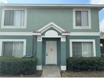 Two-story townhome with light green exterior and landscaping at 1621 Fluorshire Dr, Brandon, FL 33511