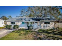 Charming single-story home featuring a well-maintained lawn, inviting entrance, and neutral exterior paint at 4601 Carson Ne St, St Petersburg, FL 33703