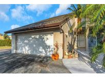 Charming home featuring a well-maintained two-car garage and a beautifully landscaped front yard at 4777 Duhme Rd # 1A, St Petersburg, FL 33708
